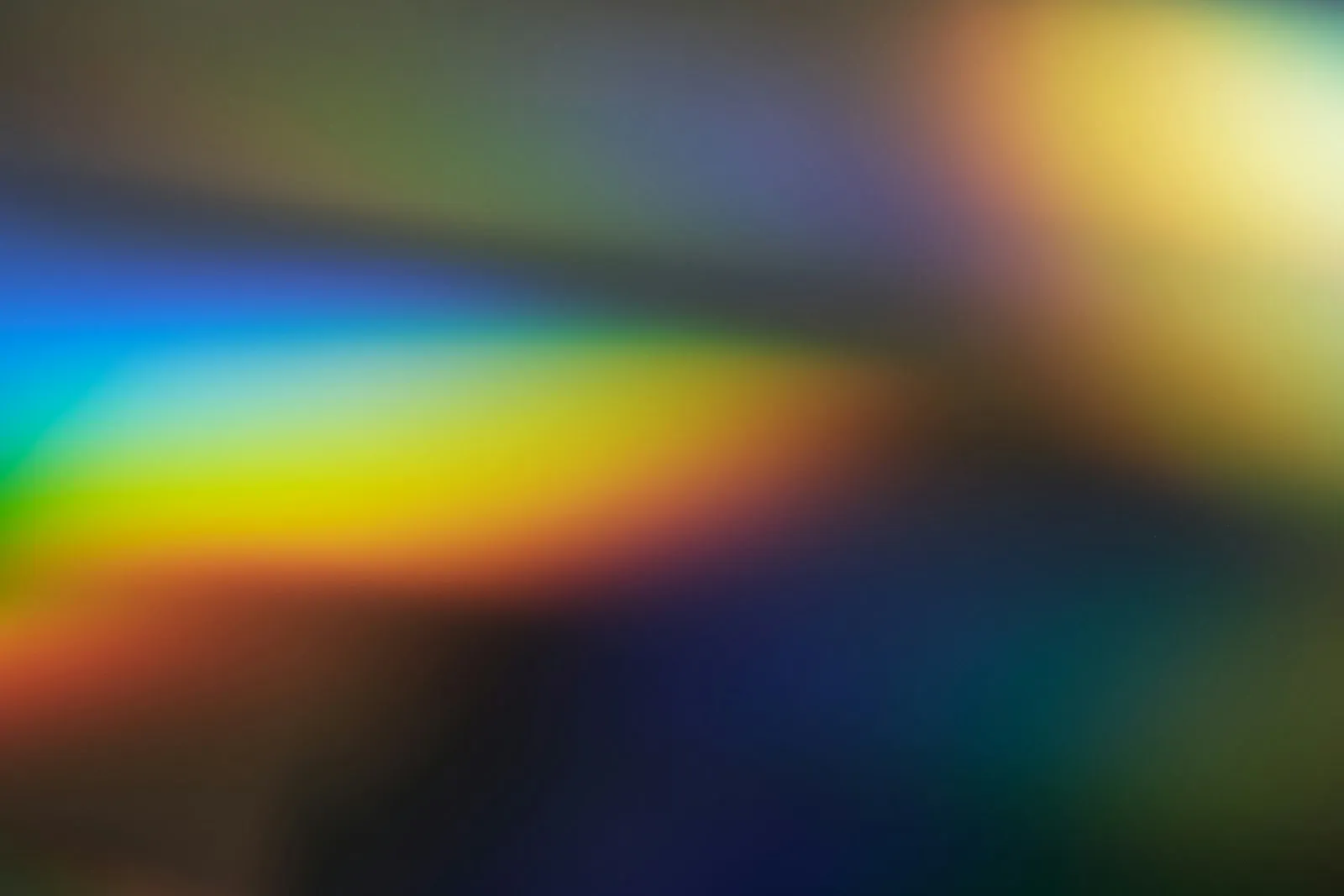 Soft rainbow light on a dark ground