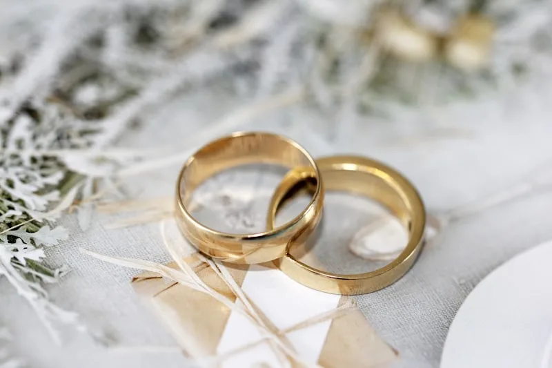 Two wedding bands resting on linen