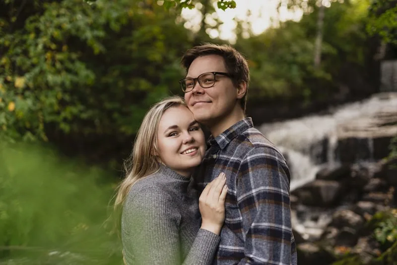 A couple holding each other and smiling
